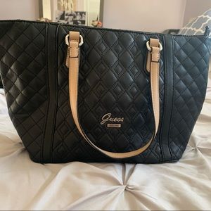 Black Guess pocketbook with tan straps